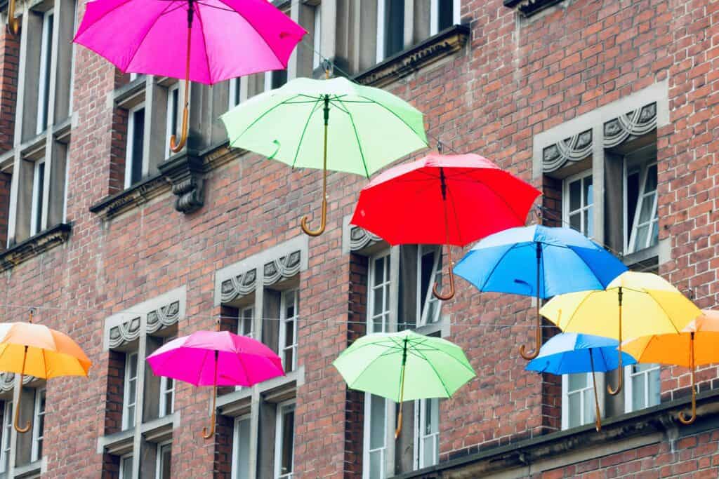 A stylish umbrella can make you stand out in the rainy winter. In the picture you can see colourful umbrellas in the air. 