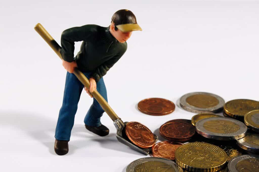 Worker and Euro coins. 