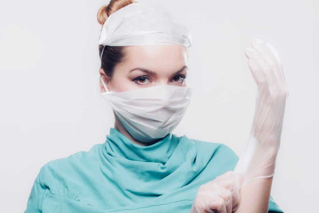 A doctor putting latex gloves on. Stranger danger can also be a doctor. 