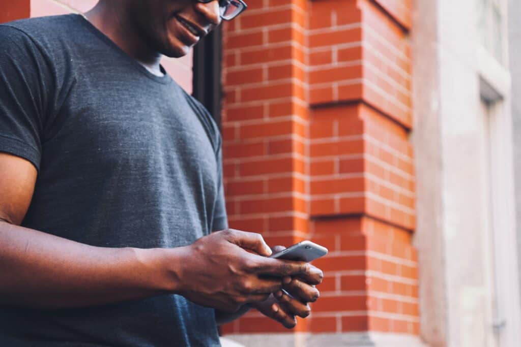 Man texting on the phone. Texting too much decreases your chance to get laid. 