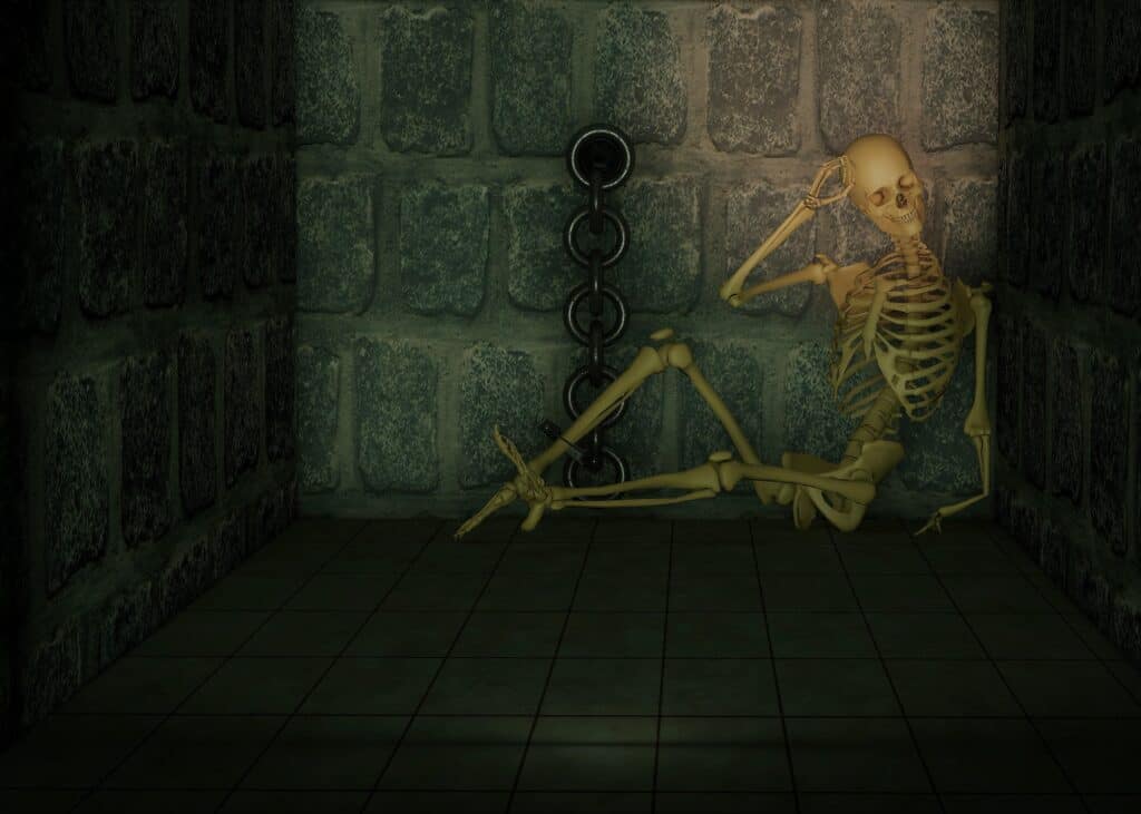 Human skeleton in a dungeon