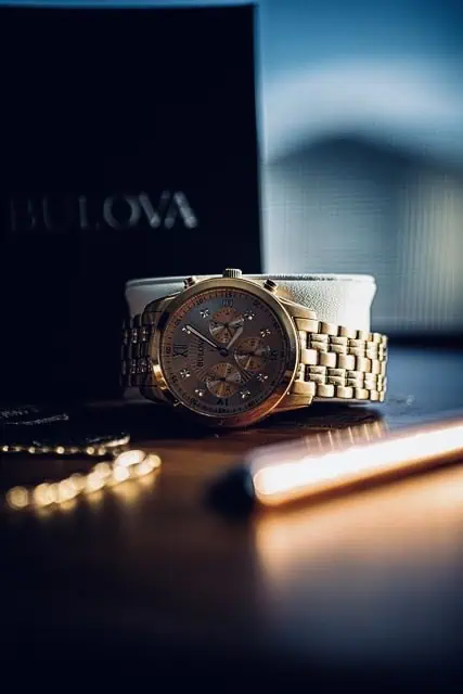 A luxury Bulova gold wristwatch on display, highlighting craftsmanship and elegance, used in a blog post about why Rolex is expensive.